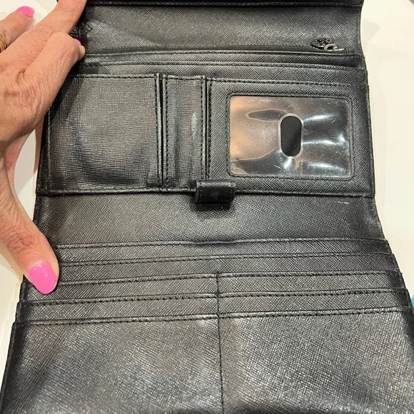 Tory Burch black large wallet with many compartments.